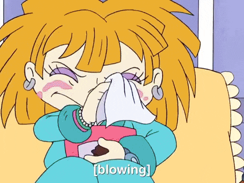 a cartoon of a girl blowing her nose with a napkin