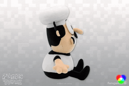 a pizza tower stuffed toy is sitting on a checkered surface