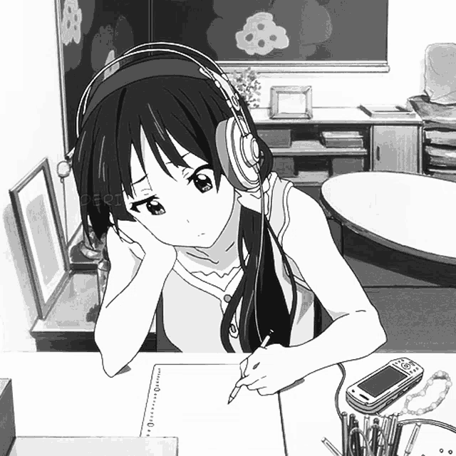 a girl with headphones is writing on a piece of paper