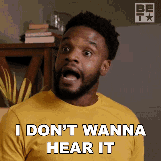a man in a yellow shirt is saying " i don 't wanna hear it "