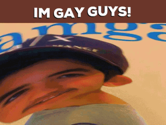 a man wearing a hat with the words im gay guys