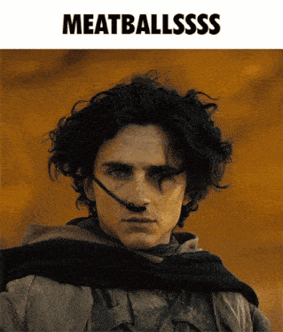 a poster of a man with a nose ring and the words meatballsss
