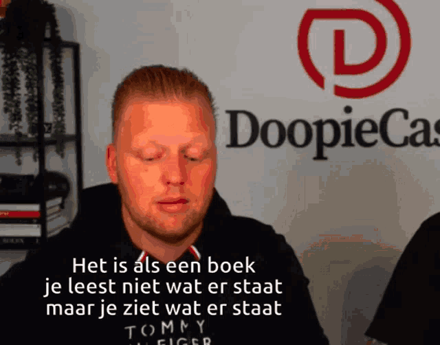 a man in front of a doopiecast logo