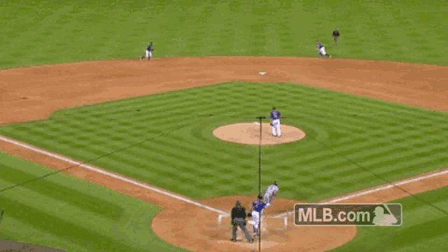 a baseball game is being played with mlb.com in the background