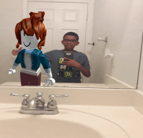a boy is taking a picture of himself in the bathroom