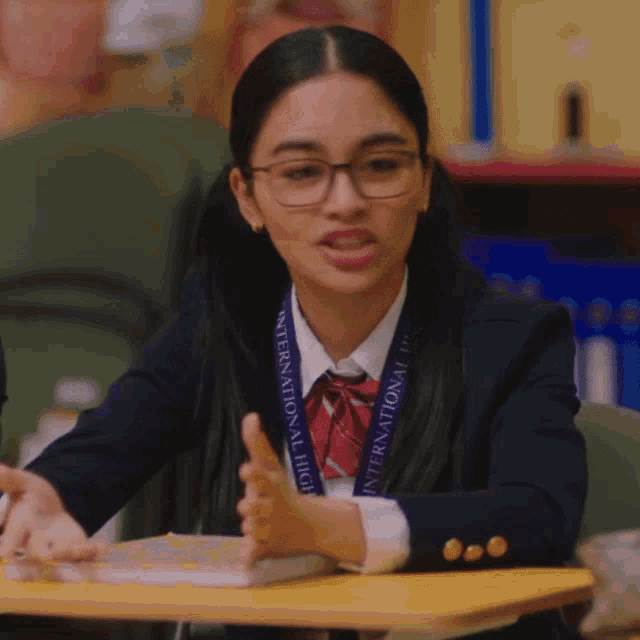 a girl wearing a lanyard that says international high