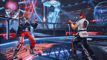 two men are fighting in a ring with a sign that says xtreme gaming in the background
