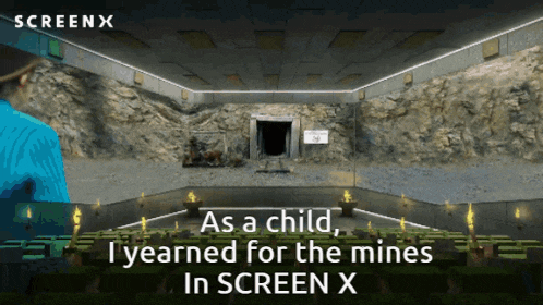 an advertisement for screen x shows a man standing in a cave