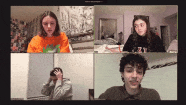 four people are on a video call and one of them is wearing an orange shirt with a dinosaur on