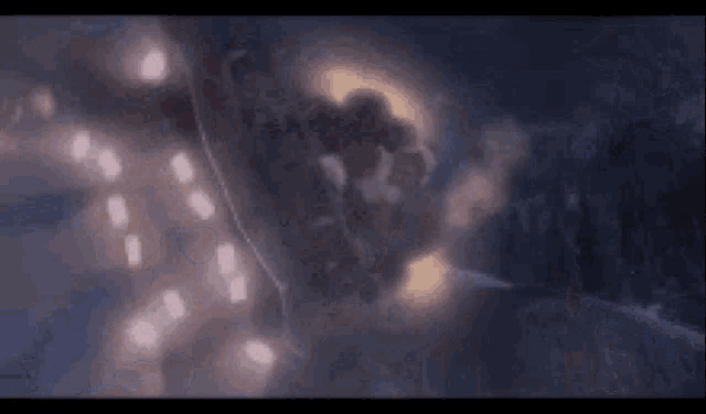a close up of a person flying through the air at night
