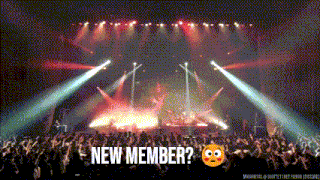 a crowd of people watching a concert with the words new member