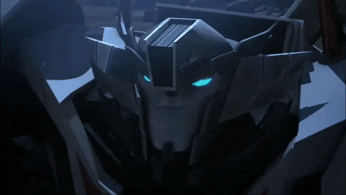a close up of a robot 's head with blue eyes