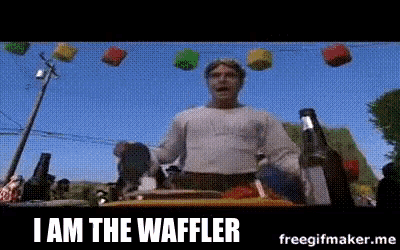 a man is standing in front of a sign that says " i am the waffle "