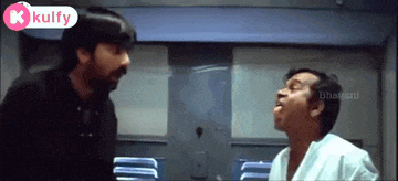 two men are standing next to each other in a room with a kulfy logo on the bottom right
