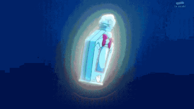 a bottle of perfume is glowing in the dark with tv asahi written on the bottom