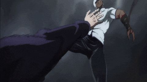 a man in a white shirt is kicking another man in the chest .