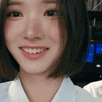 a close up of a woman 's face with a smile on her face .