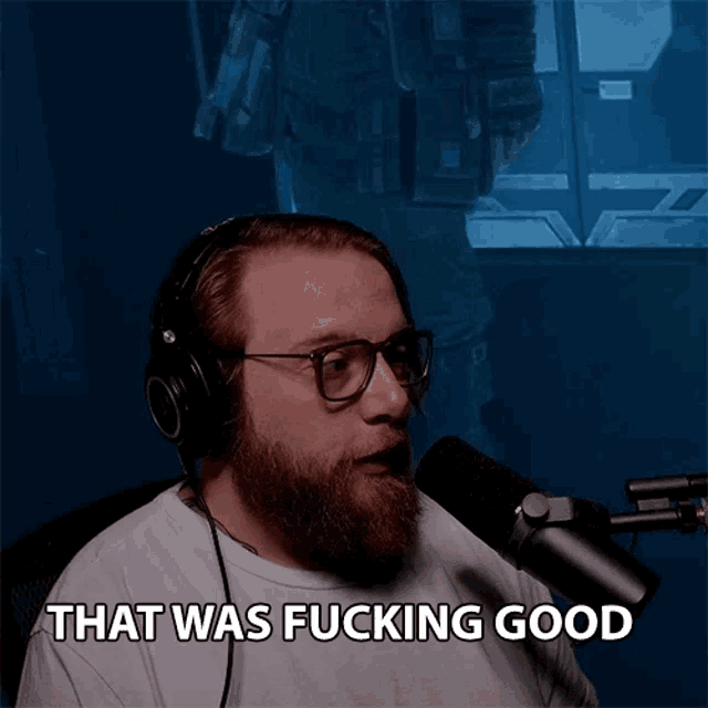 a bearded man wearing headphones and glasses says that was fucking good