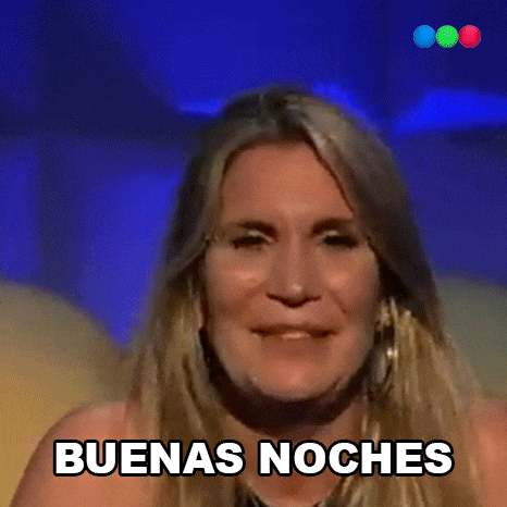 a woman says " buenas noches " while smiling
