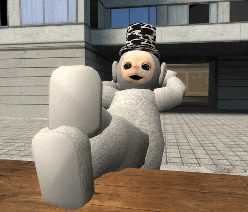 a white teddy bear wearing a top hat is laying on a wooden table