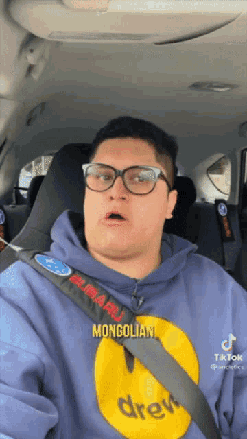 a man wearing a hoodie that says mongolian