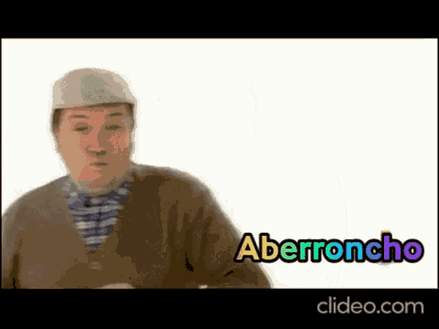 a man wearing a hat and a sweater says aberroncho in a video