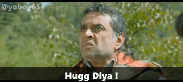 a man with a beard is looking up with the words hugg diya above him