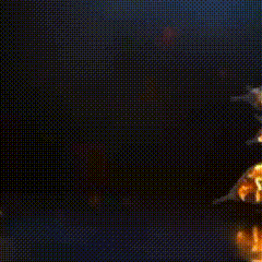 a bunch of sharks are flying through the air in a dark room