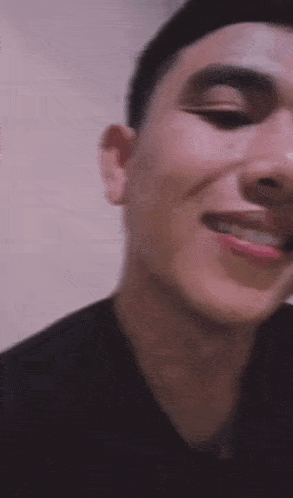a close up of a man 's face smiling