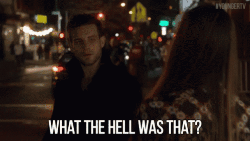 a man and a woman are looking at each other and the man is saying what the hell was that