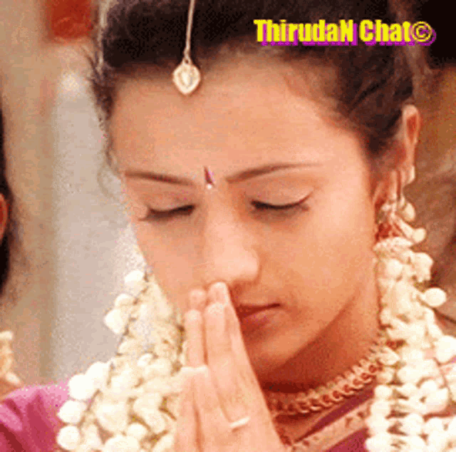 a close up of a woman 's face with the words thirudan chat on the bottom right