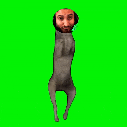 a man with a beard and headphones is standing in front of a green screen ..