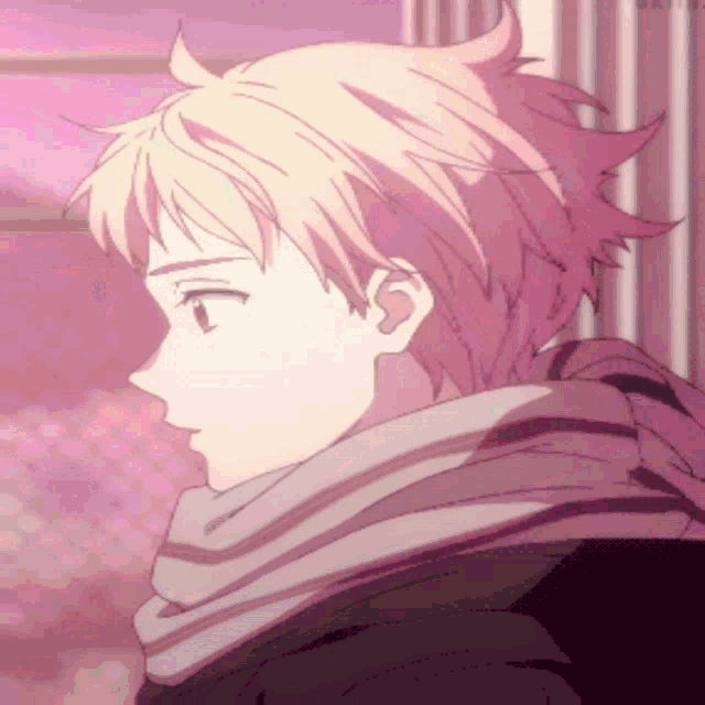 a close up of a person 's face with a scarf around his neck