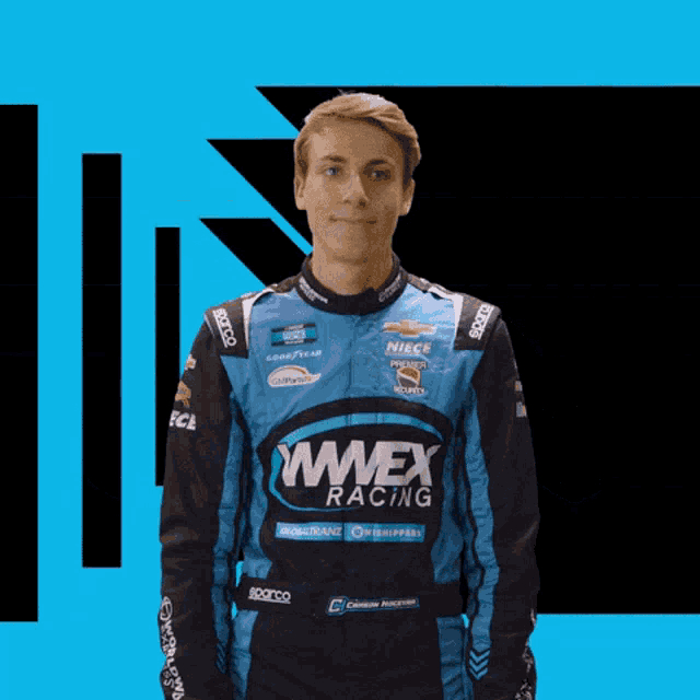 a man wearing a jacket that says wwwex racing