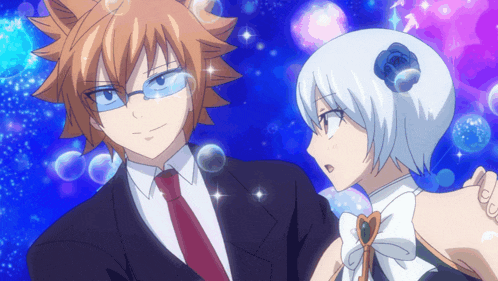 a man in a suit and tie is standing next to a girl with a flower in her hair