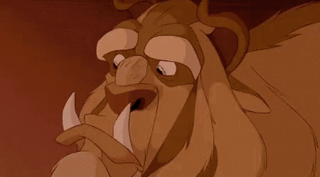 a close up of a cartoon character 's face with a very large mouth and teeth .