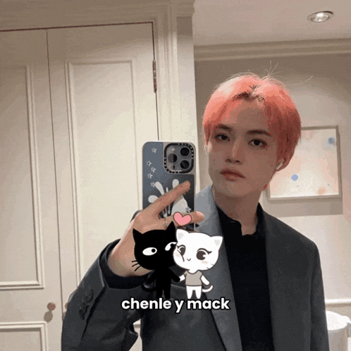 a man taking a picture of himself in a mirror with the caption chenle y mack on the bottom