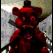 a red teddy bear with a knife in its neck