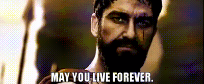 a man with a beard is holding a sword and saying `` may you live forever '' .