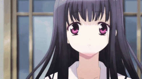 a close up of a girl with purple eyes