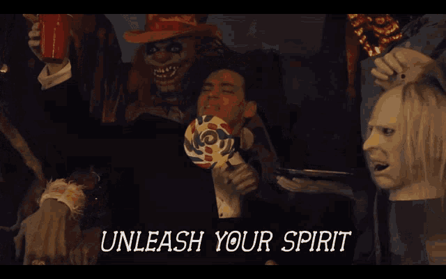 a man holding a lollipop with the words unleash your spirit on the bottom