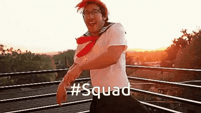 a man in a sailor outfit is dancing on a balcony with the word squad written on the bottom
