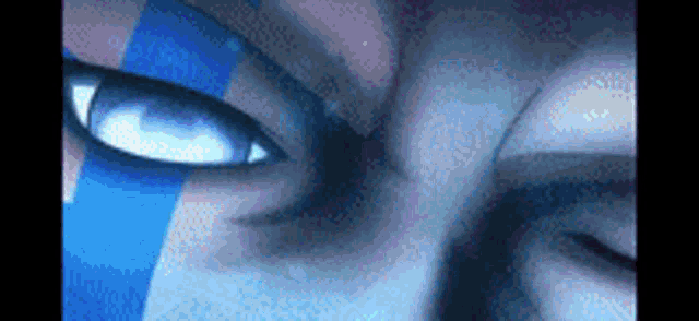 a close up of a person 's eyes with a blue stripe on them .