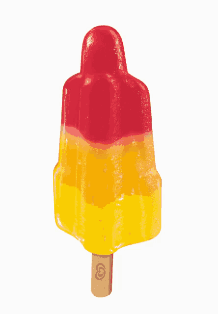 a yellow and red popsicle with a wooden stick with the letter g on it