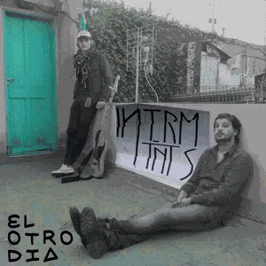 a man sitting on the ground next to a man holding a guitar with the words " el otro dia " written on the bottom