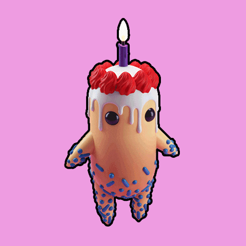 a figurine of a cake with a candle on top of it