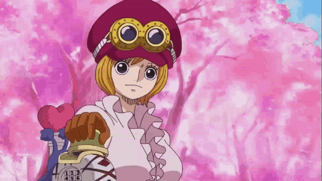 a girl wearing a red hat and goggles is holding a bottle with a crown on it