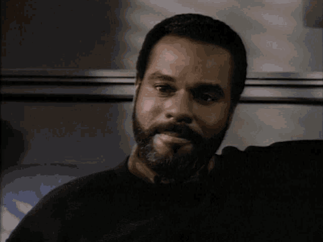 a man with a beard talks about aids