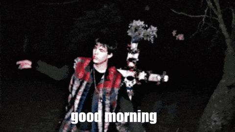 a man standing next to a cross with the words good morning written on the bottom