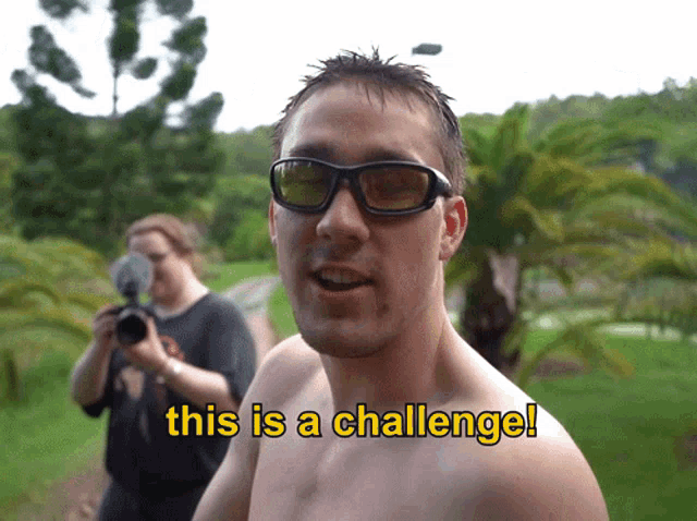 a man wearing sunglasses says this is a challenge while a woman takes a picture
